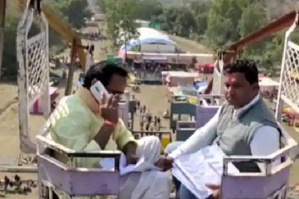 MP minister climbs atop village fair swing for phone signal
