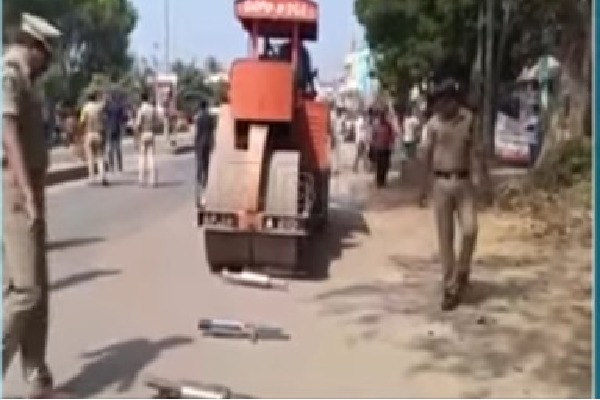 Police crushed heavy noisy silencers with a road roller