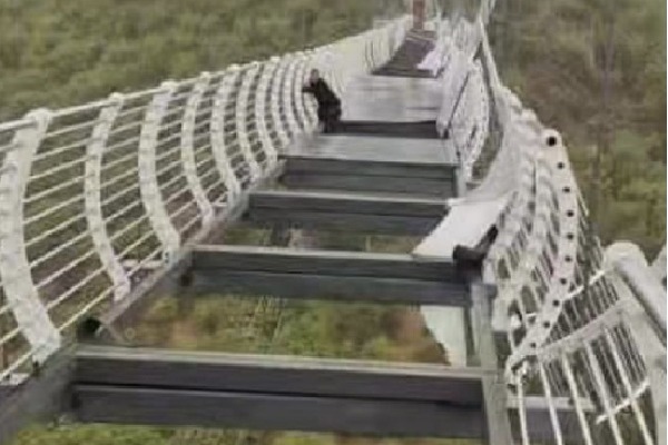 Man Left Dangling From 330 Foot Glass Bridge As Strong Winds Shatter Panels