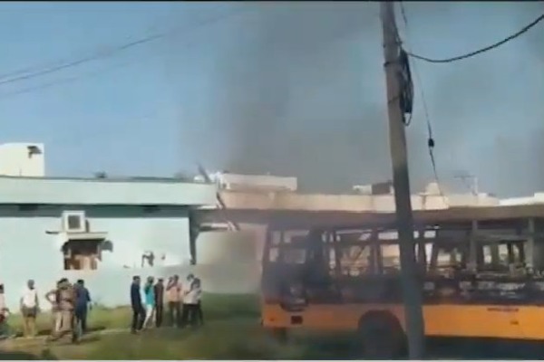School buses parked near a church in Pulivendula caught in fire