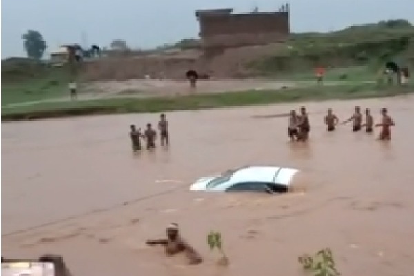 Locals Jump Into River To Save Newlywed Couple In A Half Sunk Car