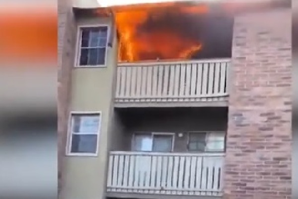 Man catches three year old dropped from burning building 