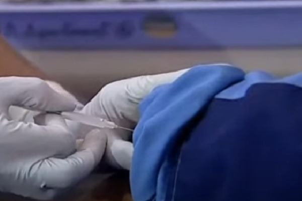 sanitation worker takes first vaccine in telangana