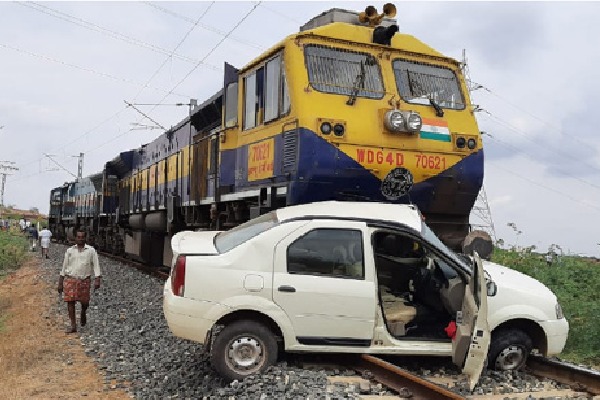 Rail engines drags car for 200 m in Kadapa Dist