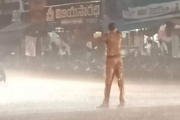 Police constable did his job despite a heavy rain 