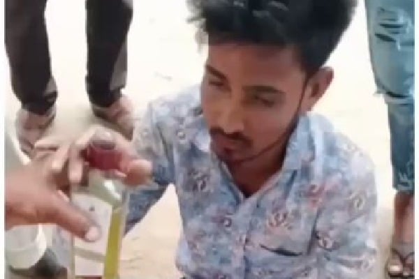 a man forced to drink urine 