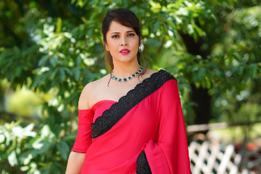 anchor Anasuya looks elegant in her red coloured saree pics