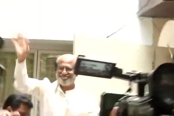 Rajinikanth greets fans gathered outside his residence