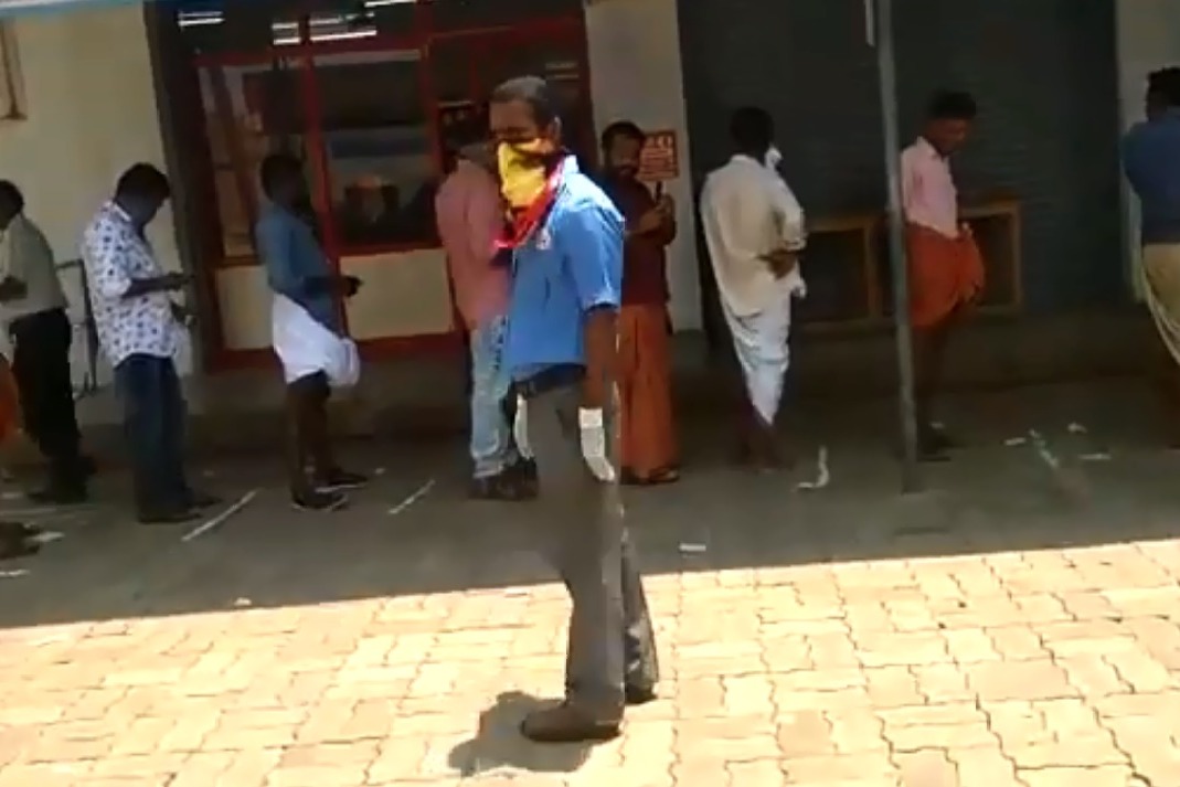 Customers Queue in front of Kerala Wines Shop