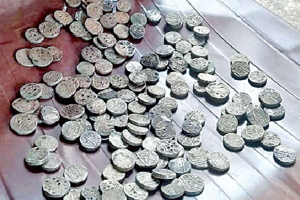 Antique silver coins found while flattening the farm in Vikarabad
