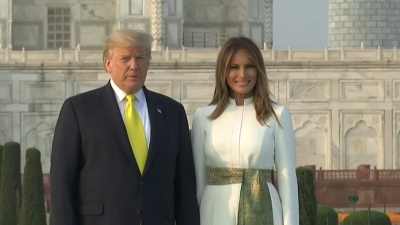 US President Donald Trump writes in visitors book at Taj Mahal