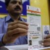 AP postal Department linking mobile number with Aadhar at door step