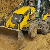 Andhra Police uses JCB to scrape hillside to deblock roadway