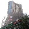Equity indices close flat as global cues subdue sentiments