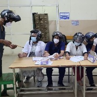 Junior doctors at Hyderabad's Osmania Hospital wear helmets