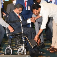 CM Jagan adjusts Kathi Padmarao wheel chair pedals