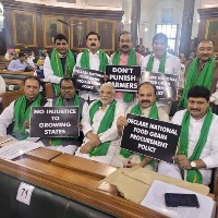 TRS MPs shows placards in Parliament sessions 