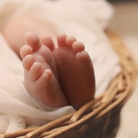 Woman gives birth to baby