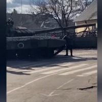 Ukrainian man tries to stop Russian tank with his bare hands