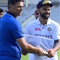 Virat Kohli felicitated with a special cap by India coach Rahul Dravid 