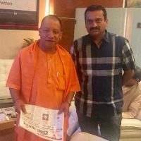 Bandla Ganesh calls on Yogi, wishes him for becoming UP CM for second time 