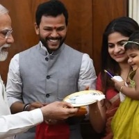 Modi gives chocolates to Rammohan Naidu daughter