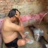 UP Minister Nand Gopal Gupta takes bath in an ordinary way
