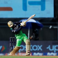 Dinesh Karthik flamboyant innings lead to huge total for RCB