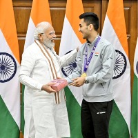 Badminton star Lakshya Sen gives sweet box to PM Modi