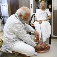 Modi takes blessings of his mother on her 100th birthday