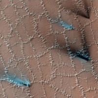 Bizarre polygons are cracking through the surface of Mars