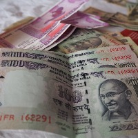 The value of rupee to another historic low per dollar