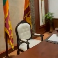 Sri Lankan military personnel guard the Prime Minister chair in his office