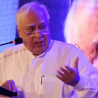 Kapil Sibal to take oath again today in RS