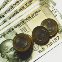 Rupee gains 51 paise to close at 79.25 against US dollar