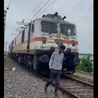 Youth escapes life threat after he tried to walk down with running train