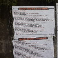 Modi Must Answer posters come up near parade grounds