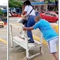 Man earns money by transporting people across waterlogged roads