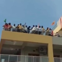 TDP leaders protest on a building near AP Assembly