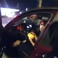 US teen eating burger in car shot by Cop