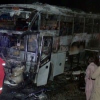 Pakistan bus fire kills at least 18 flood survivors in Karachi