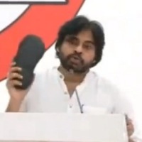 Angry Pawan Kalyan shows 'chappal' to warn YSRCP