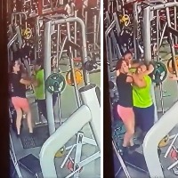 Women slap each other over gym equipment