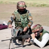 Vijay Deverakonda shoots with a rifle along with a jawan