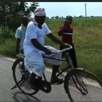 KA Paul cycling in campaign 