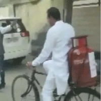 WITH GAS CYLINDER ON BICYCLE CONGRESS MLA REACHES POLLING BOOTH