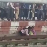 Karnataka Mother and Son Narrow Escape As Train Whizzes Past