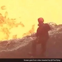 Man Stands At The Edge Of A Lava Ocean In Hair Raising Video