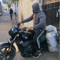 Man Uses Harley Davidson Bike for Milk Supply