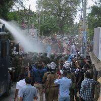 Tamil Protesters In Sri Lanka Pull Out Shampoo To Wash Hair As Police Fire Water Cannons